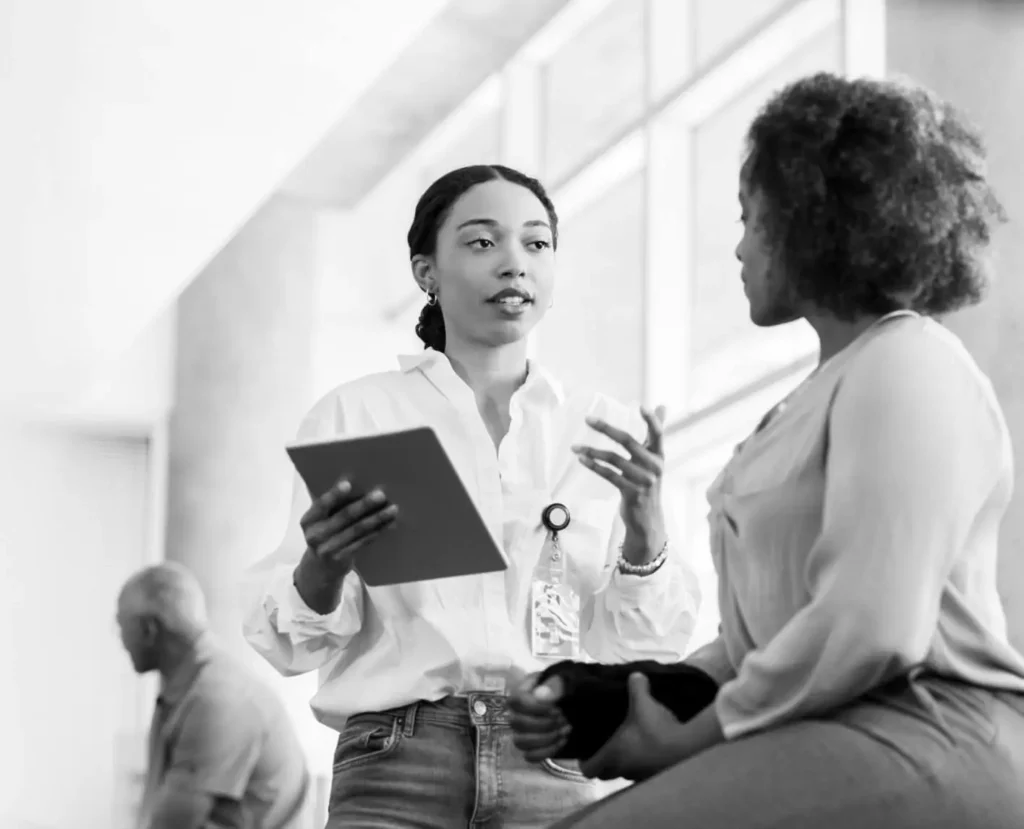 A medical professional consults with a patient.