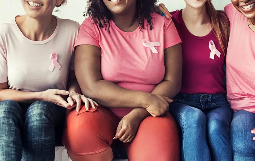 A group of women wearing pink for breast cancer awareness.