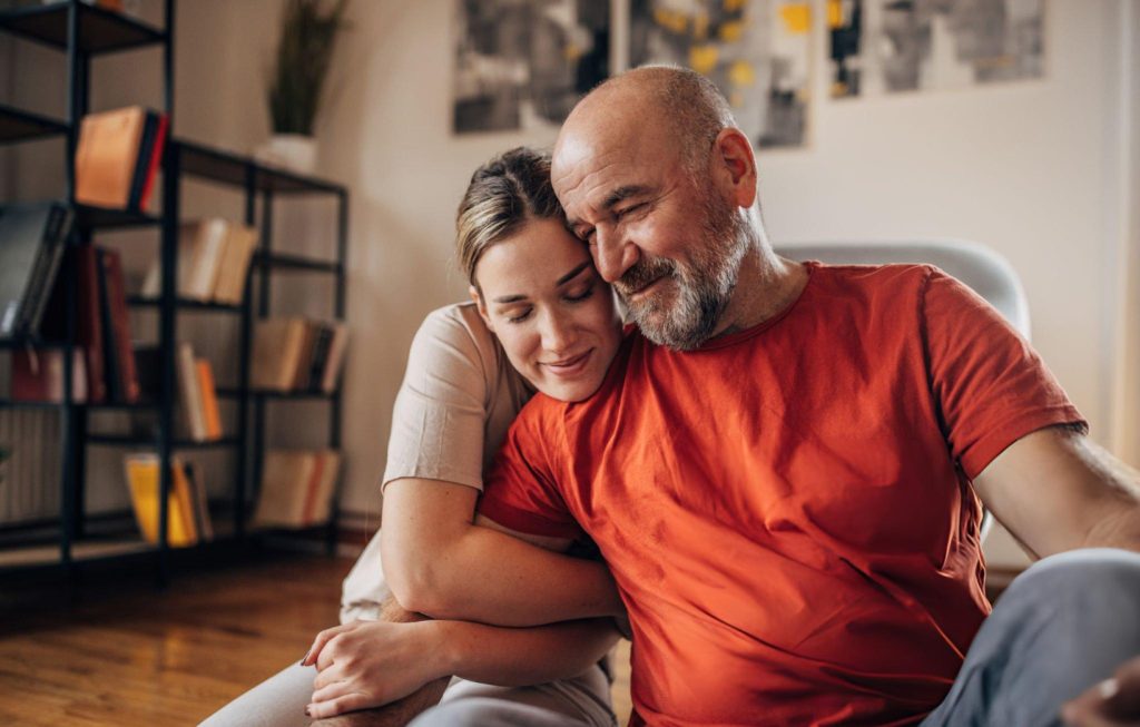 father and daughter embrace